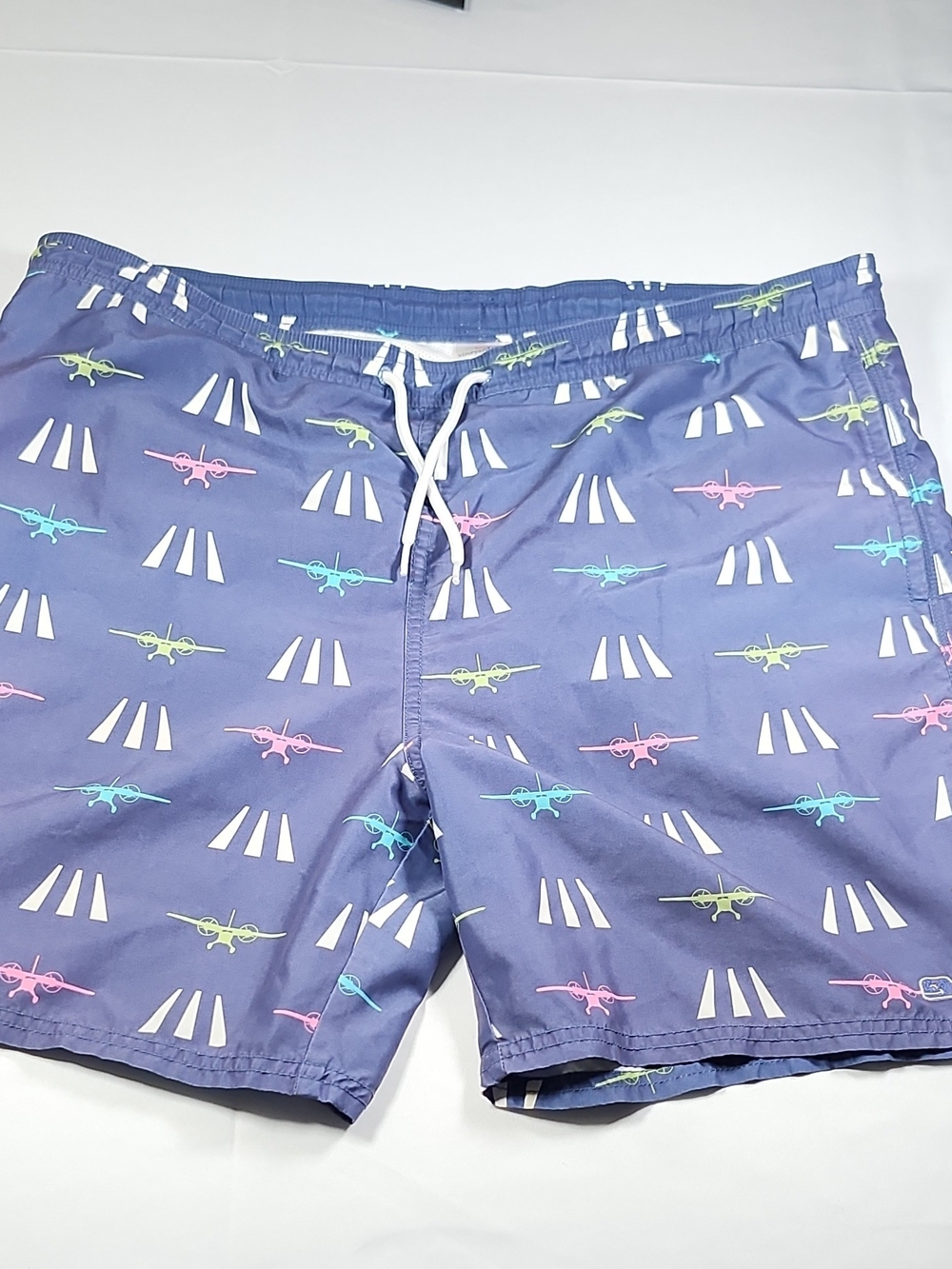 Vineyard Vines Navy Swim Trunks with Pink, Teal & Lime Plane Print